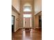 Grand foyer featuring hardwood floors, soaring ceilings, and a view of the bright, airy entryway at 2504 Fawn Bluff Ct, Zionsville, IN 46077