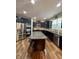 Modern kitchen featuring stainless steel appliances, granite countertops, and a large island at 2504 Fawn Bluff Ct, Zionsville, IN 46077