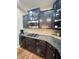 Gourmet kitchen with granite countertops, stainless appliances and modern cabinetry at 2504 Fawn Bluff Ct, Zionsville, IN 46077