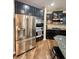 Contemporary kitchen featuring stainless steel appliances and sleek dark cabinetry at 2504 Fawn Bluff Ct, Zionsville, IN 46077