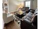 Comfortable living room with leather recliners, decorative rug, and neutral walls creating a cozy atmosphere at 2504 Fawn Bluff Ct, Zionsville, IN 46077