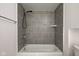Bathroom featuring a shower/tub combo and gray tile at 2832 S Oakland Ave, Indianapolis, IN 46203
