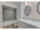 Clean bathroom with a tub, shower, and updated vanity at 2832 S Oakland Ave, Indianapolis, IN 46203