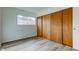 Bedroom with wood sliding doors, new flooring, and a window at 2832 S Oakland Ave, Indianapolis, IN 46203