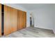 Bright bedroom with wood sliding doors and new laminate flooring at 2832 S Oakland Ave, Indianapolis, IN 46203
