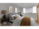 Comfortable bedroom with a bed flanked by mid-century modern nightstands and light filtering window at 2832 S Oakland Ave, Indianapolis, IN 46203