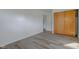 Bedroom with wood sliding doors and access to hallway at 2832 S Oakland Ave, Indianapolis, IN 46203