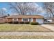 Brick ranch house with attached garage and well-maintained lawn at 2832 S Oakland Ave, Indianapolis, IN 46203