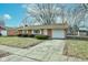 Brick ranch house with attached garage and neat landscaping at 2832 S Oakland Ave, Indianapolis, IN 46203