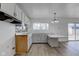 Bright eat-in kitchen with white cabinets and new flooring at 2832 S Oakland Ave, Indianapolis, IN 46203