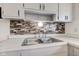 Clean kitchen sink with new countertops at 2832 S Oakland Ave, Indianapolis, IN 46203