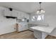 Bright eat-in kitchen with white cabinets and new flooring at 2832 S Oakland Ave, Indianapolis, IN 46203