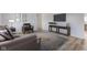 Cozy living room with wood floors, stylish furniture, and a mounted flat screen television at 2832 S Oakland Ave, Indianapolis, IN 46203