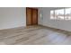 Bright living room with wood-look laminate floors at 2832 S Oakland Ave, Indianapolis, IN 46203