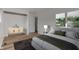 Serene bedroom with neutral walls, area rug, and comfortable bed with decorative pillows and blankets at 2832 S Oakland Ave, Indianapolis, IN 46203