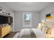 Main bedroom with a light wood dresser and neutral bedding at 2875 Adams St, Indianapolis, IN 46218