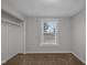Simple bedroom with carpet, closet, and window at 2875 Adams St, Indianapolis, IN 46218
