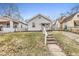 Charming bungalow with steps leading to the front entrance at 2875 Adams St, Indianapolis, IN 46218