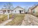 Cute bungalow home with a small front yard and driveway at 2875 Adams St, Indianapolis, IN 46218