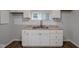 White shaker cabinets and a new stainless steel sink at 2875 Adams St, Indianapolis, IN 46218