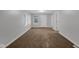 Living room with neutral walls and brown carpeting at 2875 Adams St, Indianapolis, IN 46218