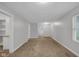 Bright and airy living room with neutral carpeting at 2875 Adams St, Indianapolis, IN 46218