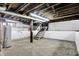 The basement features unfinished walls and floors with exposed pipes and a water heater at 403 Colescott St, Shelbyville, IN 46176