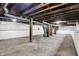 The basement features unfinished walls and floors with exposed pipes at 403 Colescott St, Shelbyville, IN 46176