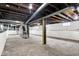 Unfinished basement with concrete floor and white-painted walls at 403 Colescott St, Shelbyville, IN 46176