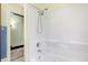 This bathroom features a white tub and shower at 403 Colescott St, Shelbyville, IN 46176