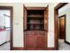 Charming, built-in hutch with wooden doors and drawers for storage and display, adding character at 403 Colescott St, Shelbyville, IN 46176