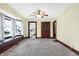 Dining area with plush carpeting and vintage ceiling fan at 403 Colescott St, Shelbyville, IN 46176