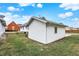 Exterior view of a white home with a detached garage and green grass at 403 Colescott St, Shelbyville, IN 46176