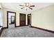 Spacious living room with classic wood trim, built-in storage, and access to other rooms in the home at 403 Colescott St, Shelbyville, IN 46176