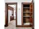 Kitchen pantry featuring wood door and built in shelves for easy kitchen storage at 403 Colescott St, Shelbyville, IN 46176