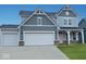 Charming two-story home with gray siding, white trim, two-car garage, and welcoming front porch at 552 Bluestem Ln, New Whiteland, IN 46184