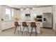 Modern white kitchen with an island, stainless steel appliances, and subway tile backsplash at 552 Bluestem Ln, New Whiteland, IN 46184