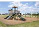 Community playground with swings and climbing equipment at 552 Bluestem Ln, New Whiteland, IN 46184