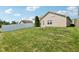 Spacious backyard with a grassy area and fence at 573 New Moon St, Avon, IN 46123