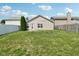 Large backyard with grass and a wooden fence at 573 New Moon St, Avon, IN 46123