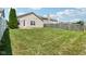 Grass lawn and a fence encompass the backyard at 573 New Moon St, Avon, IN 46123