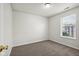 Simple bedroom with grey carpet and a window with blinds at 573 New Moon St, Avon, IN 46123