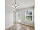 Dining area featuring tile floors, a door to the backyard, and large windows at 573 New Moon St, Avon, IN 46123