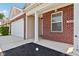 Front entrance of brick ranch home with garage at 573 New Moon St, Avon, IN 46123