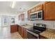 Kitchen with stainless steel appliances and wood cabinets at 573 New Moon St, Avon, IN 46123