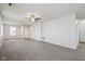Large living room with grey carpet and ceiling fan at 573 New Moon St, Avon, IN 46123