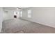 Spacious living room with neutral carpeting and ceiling fan at 573 New Moon St, Avon, IN 46123