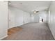 Open living room with carpet, tile, and door to kitchen at 573 New Moon St, Avon, IN 46123