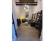 This living room features a couch, an armchair, and stylish bookshelves, offering a cozy and inviting space at 630 N College Ave # 401, Indianapolis, IN 46204