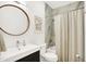 Clean and modern bathroom with a bathtub, shower, and stylish vanity at 630 N College Ave # 401, Indianapolis, IN 46204